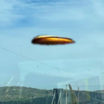 UFO SAN GIORGIO DEL SANNIO 14.03.2023 - IMMAGINE OTTENUTA PRENDENDO L'UFO ORIGINALE, COLORATO DI GIALLO SCURO, CALATO IN UNA DELLE FOTO ORIGINALE